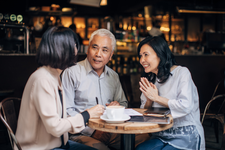 A couple meeting with a relative to discuss creating a power of attorney in Arizona.