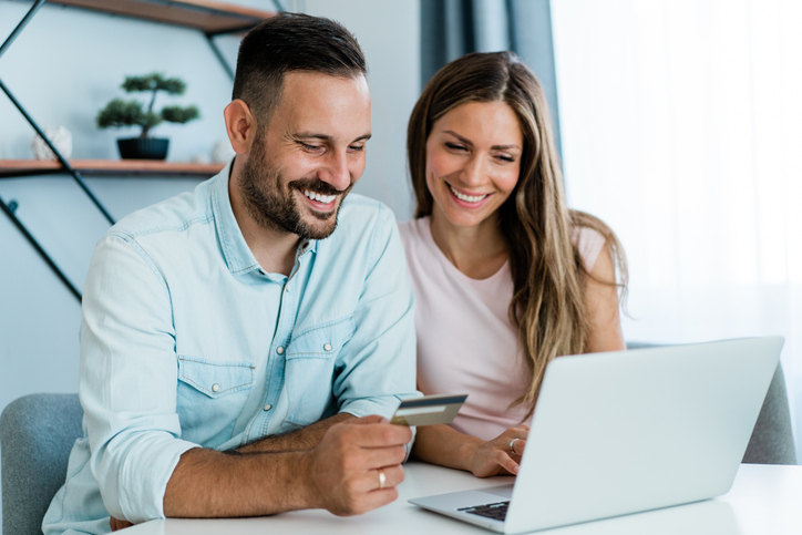 A couple checking their credit limit online.