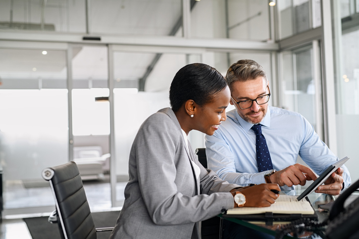 Financial advisors reviewing the cost of E&O insurance.