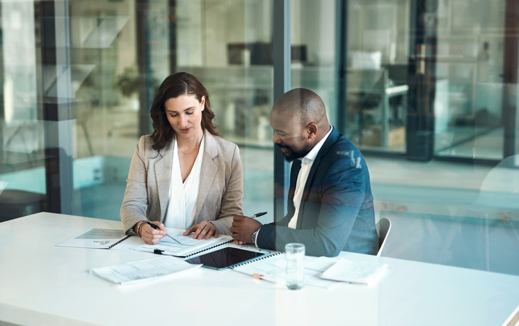 Advisors discussing how to become a fiduciary advisor.